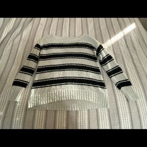 large, black and white sweater.